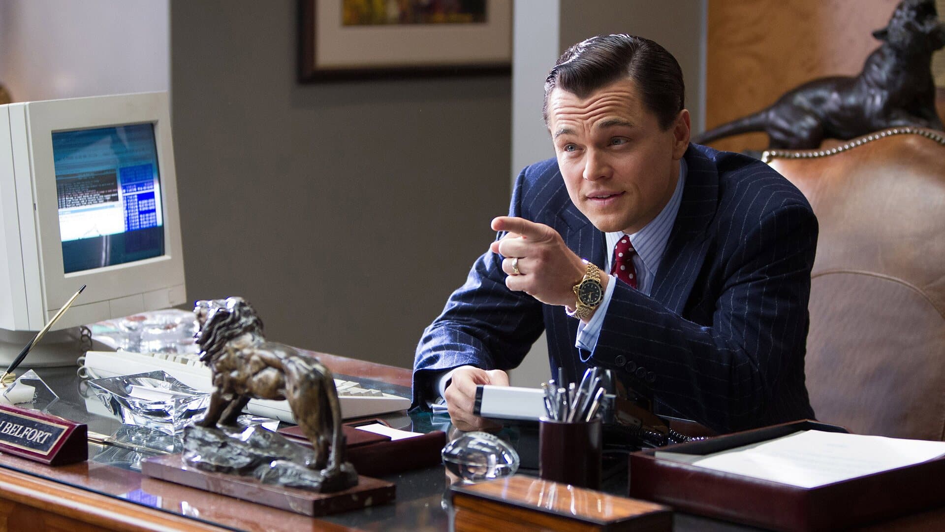 Leonardo DiCaprio as Jordan Belfort speaking on the telephone