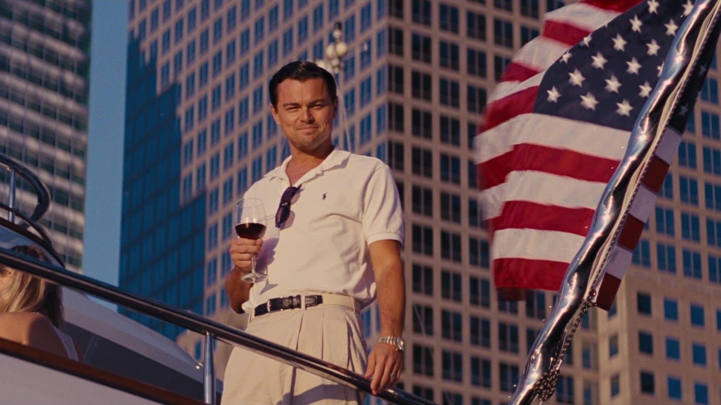 Leonardo DiCaprio as Jordan Belfort against a New York financial district backdrop